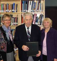 Bill Schroeder receives 2013 Award of Excellence from MHSC President Lucille Marr. His wife, Augusta, is at right.