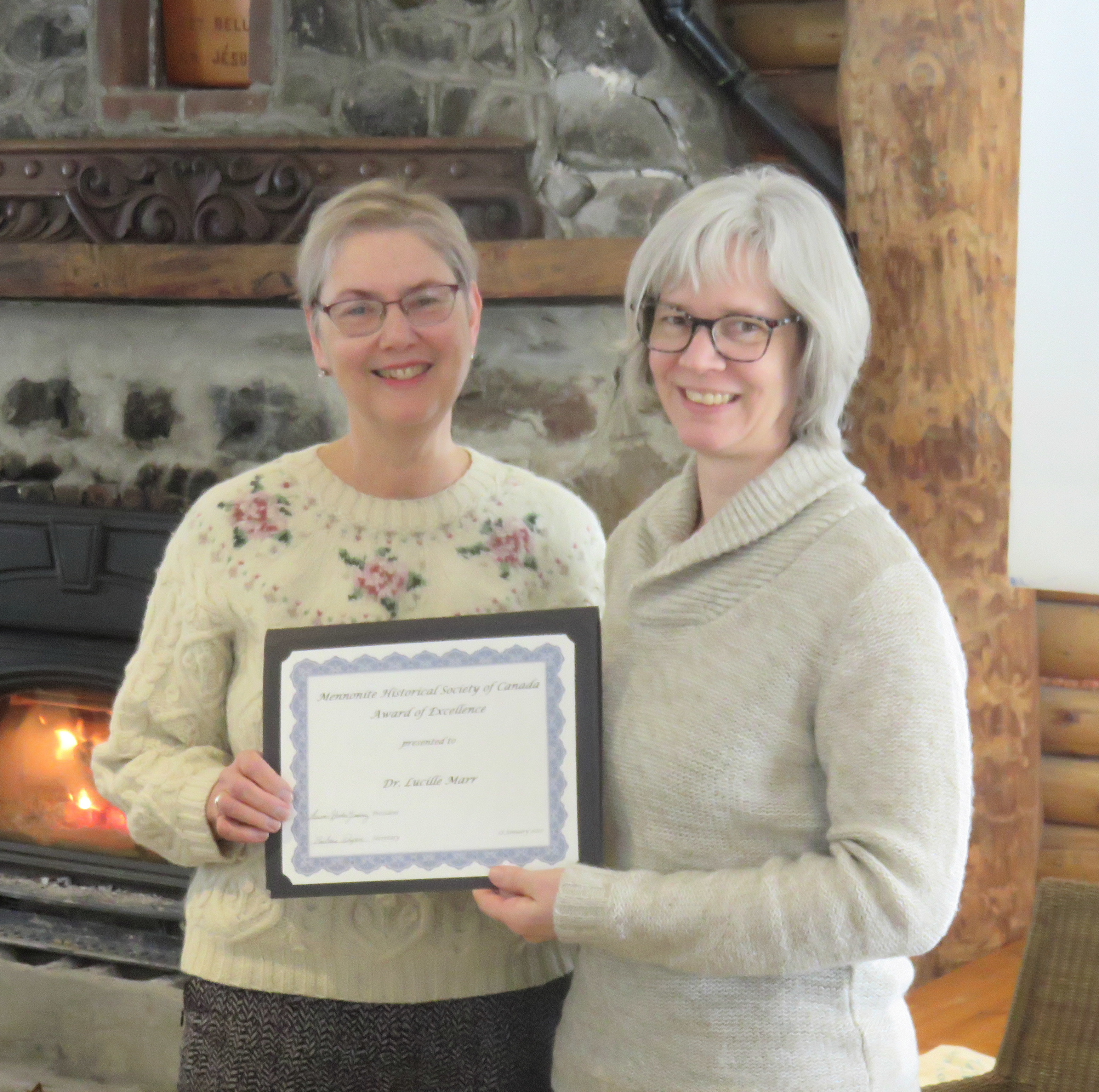 MHSC President Laureen Harder Gissing (right) presenting the 2020 Award of Excellence to Lucille Marr.