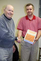 2007 photo of Dave K. Schellenberg being recognized for his many years of service with EMC archives by Don Kroeker, chair of the EMC archives committee